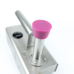 Pink silicone cleaning cap attached to an InstantVap vaporiser for cleaning