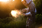Beekeeper using the InstantVap® Compact cordless oxalic acid vaporiser for varroa treatment