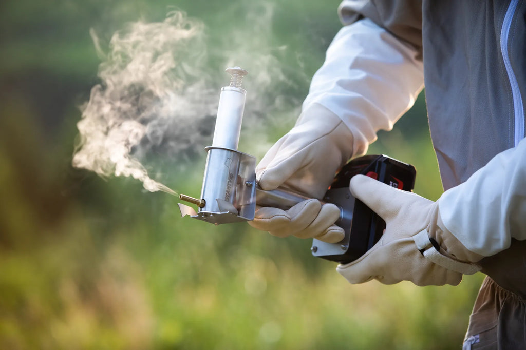 Beekeeper using the InstantVap® Lite cordless oxalic acid vaporiser for varroa treatment